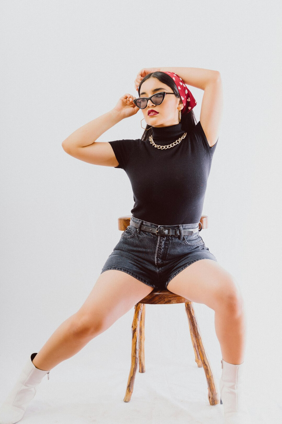 Confident young Latin woman influencer in a bright studio