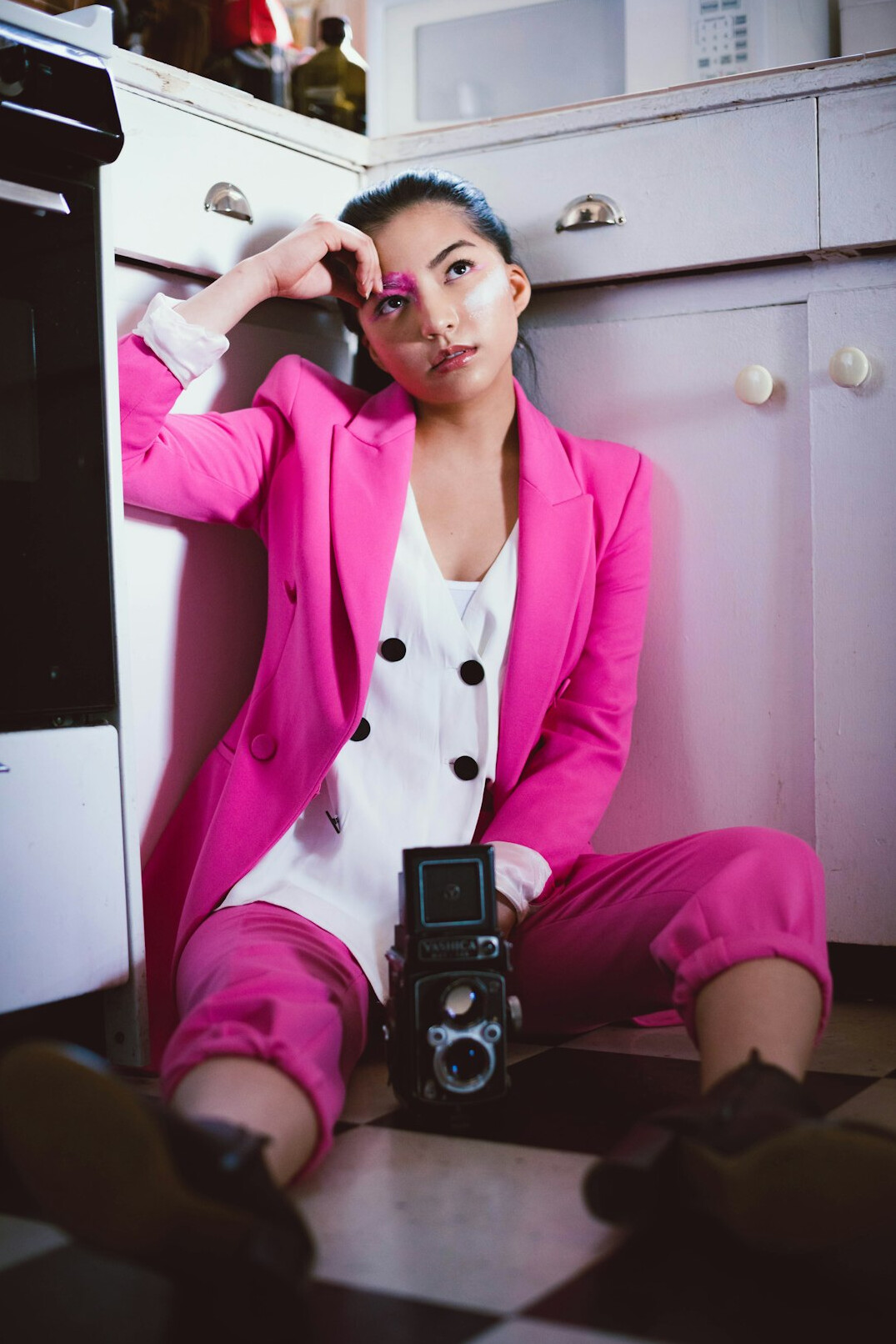 Creative Latin woman photographer looking at the camera