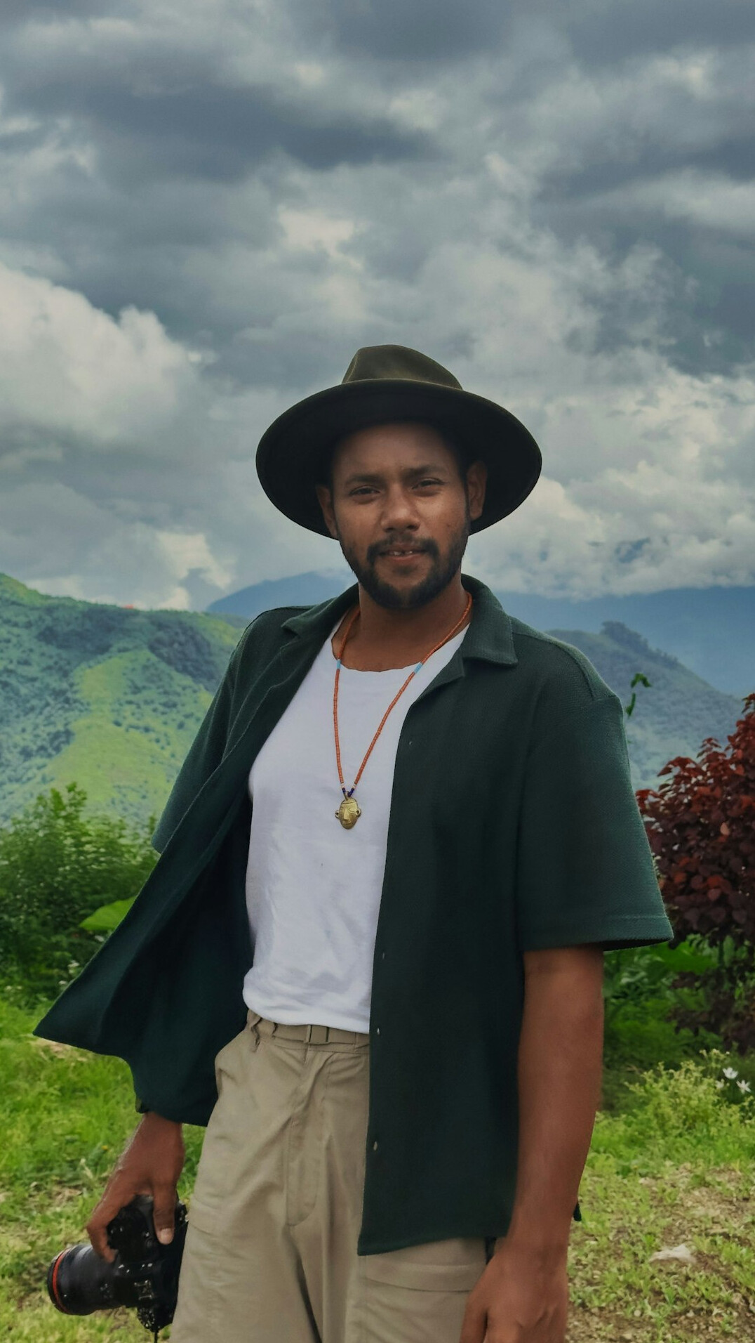 Bearded Latin man journalist smiling outdoors
